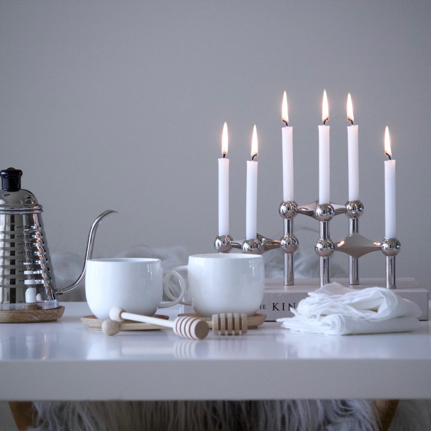 lifestyle candle holder and white candles chrome 1 71921